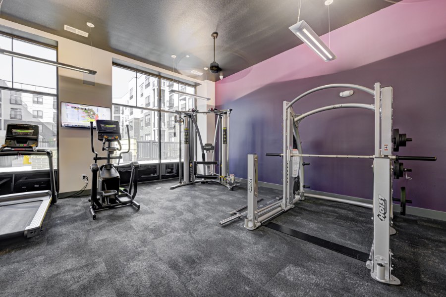 Fitness center with aerobic and weight training equipment.